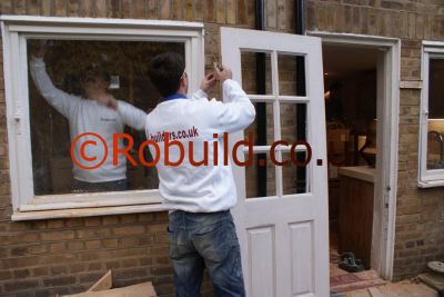carpenters fitting door windows