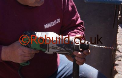 builder using a power drill